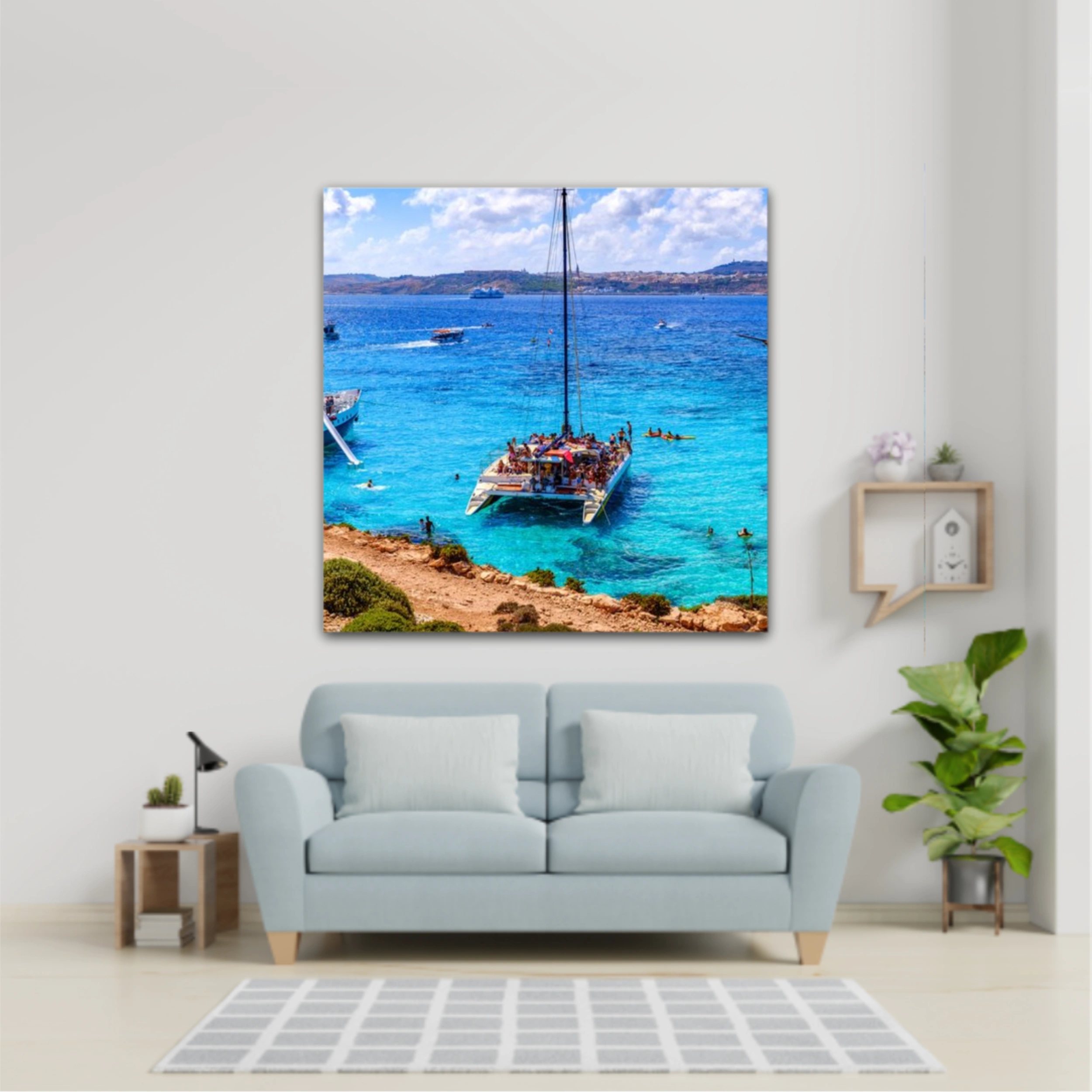 Comino, Malta. Tourists crowd at Blue Lagoon to enjoy the clear turquoise water on a sunny summer day with and boats on Comino island, Malta.