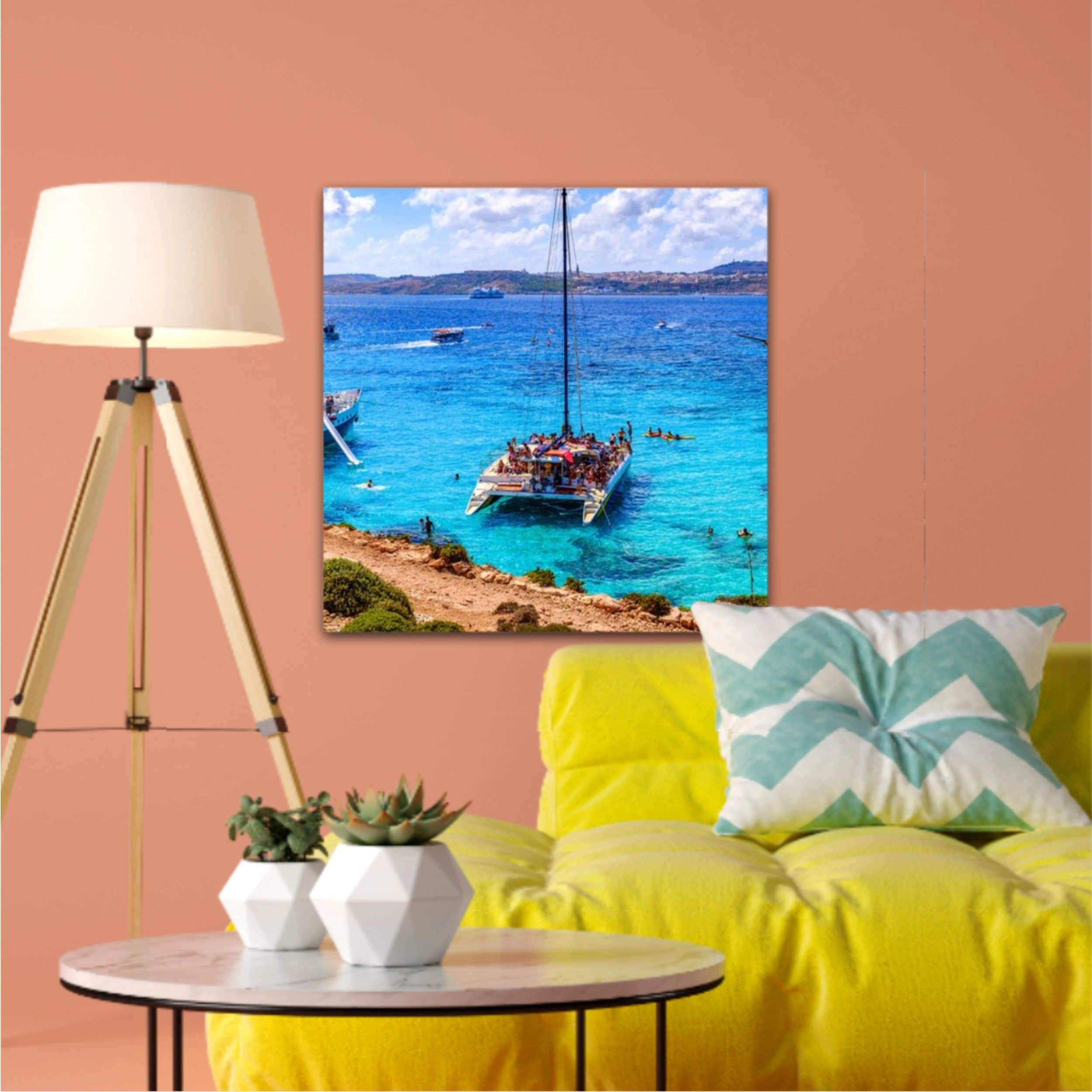 Comino, Malta. Tourists crowd at Blue Lagoon to enjoy the clear turquoise water on a sunny summer day with and boats on Comino island, Malta.