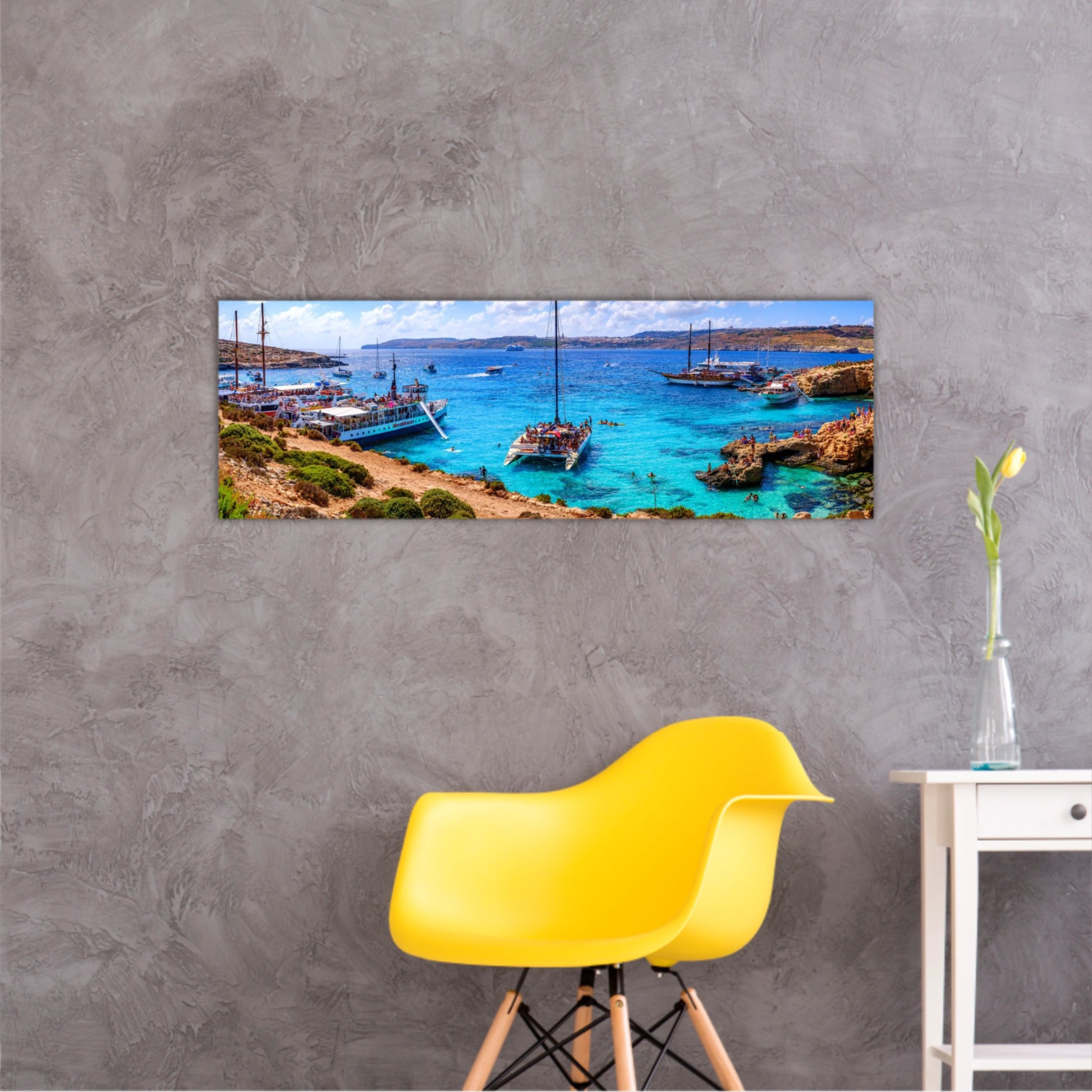 Comino, Malta. Tourists crowd at Blue Lagoon to enjoy the clear turquoise water on a sunny summer day with and boats on Comino island, Malta.