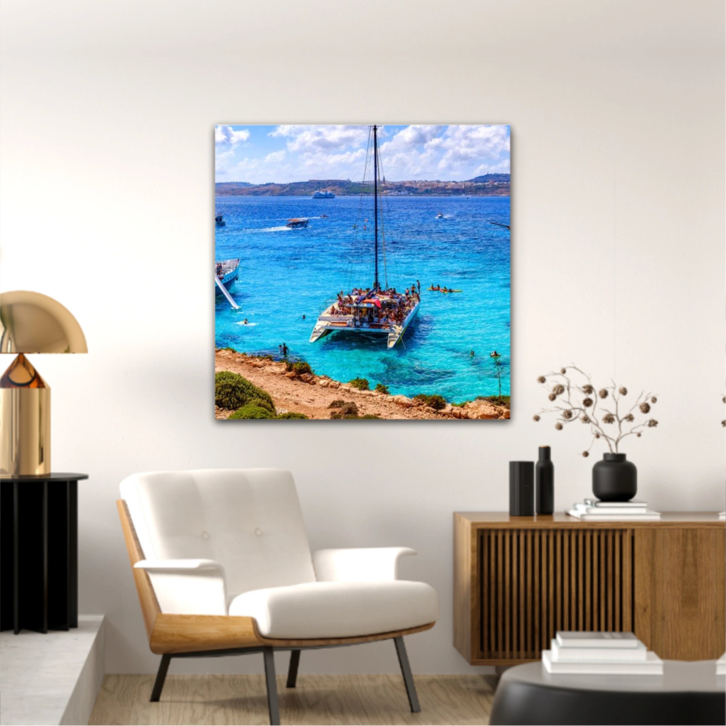 Comino, Malta. Tourists crowd at Blue Lagoon to enjoy the clear turquoise water on a sunny summer day with and boats on Comino island, Malta.