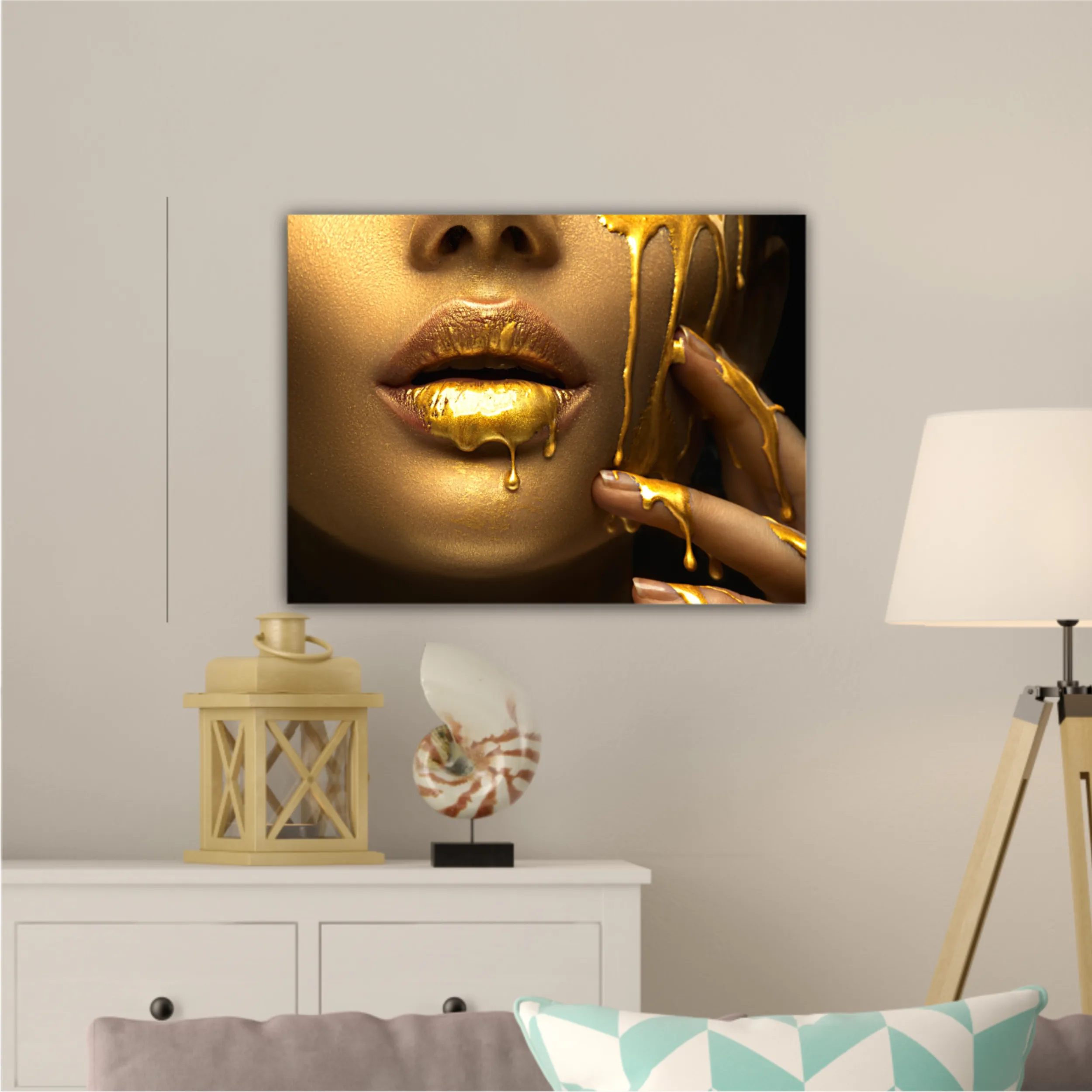 Lipgloss dripping from sexy lips, golden liquid drops on beautiful model girls mouth, gold metallic skin make-up. Beauty woman makeup close up