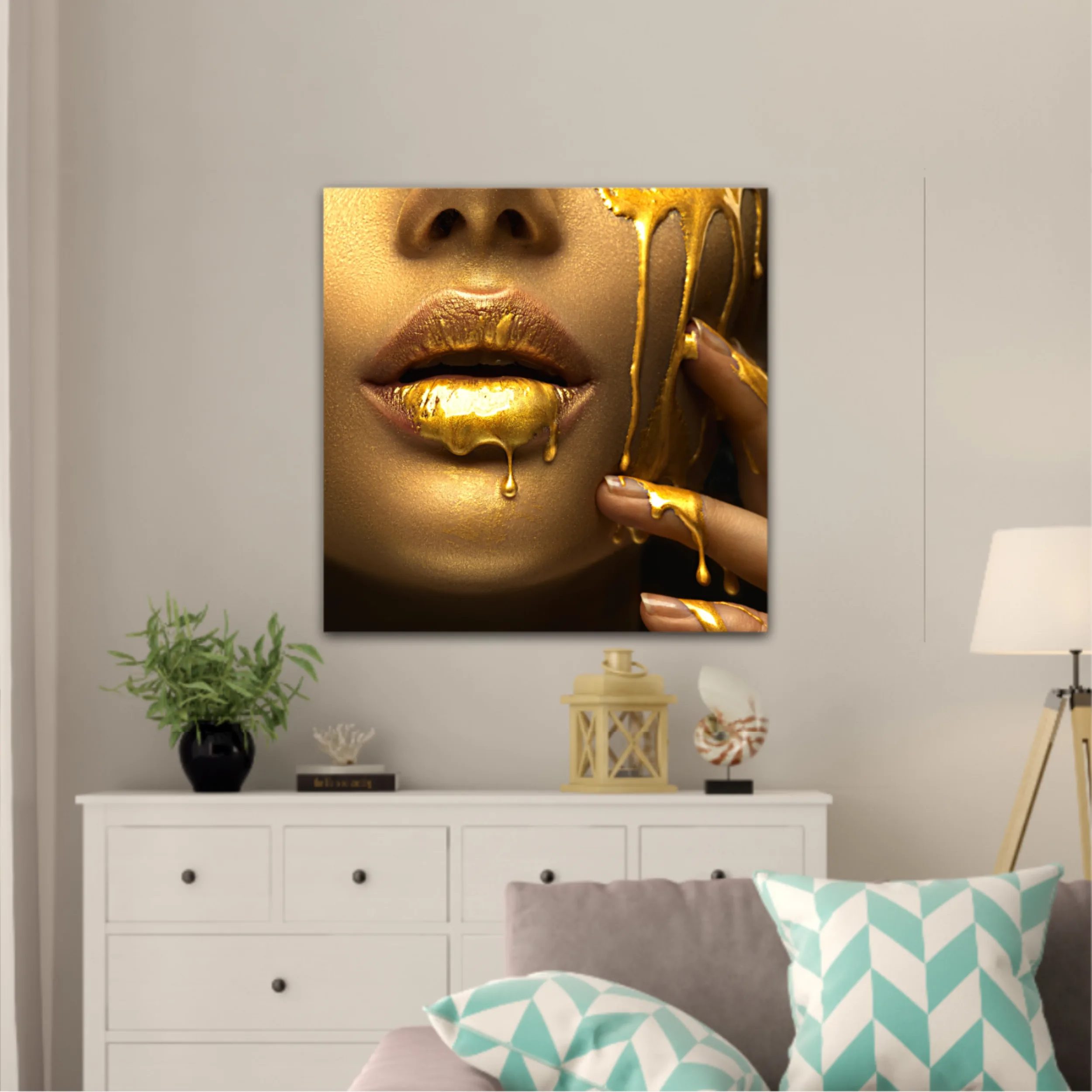 Lipgloss dripping from sexy lips, golden liquid drops on beautiful model girls mouth, gold metallic skin make-up. Beauty woman makeup close up