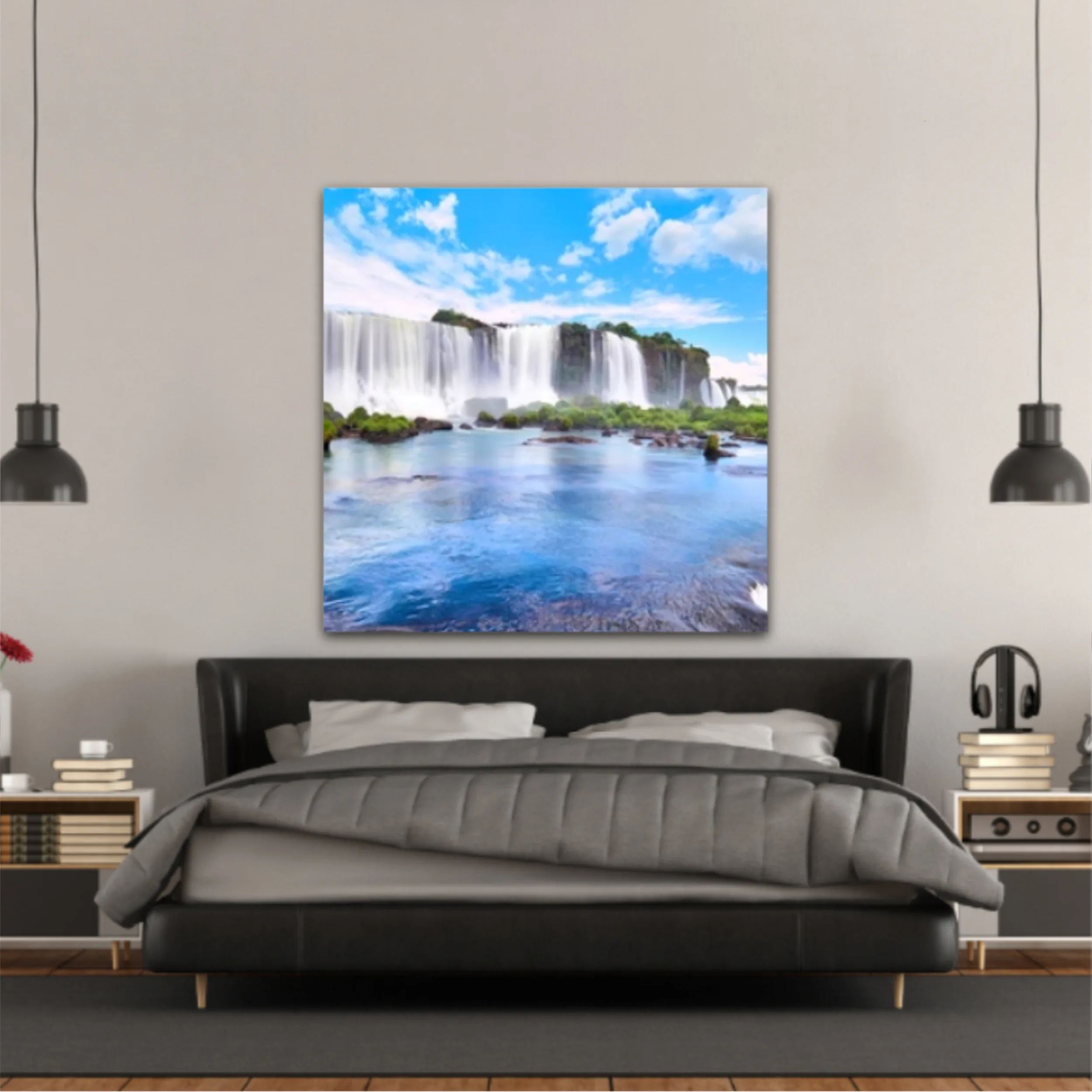 Panoramic view of many majestic powerful water cascades with mist and reflection of blue sky with clouds. Panoramic image of Iguazu valley