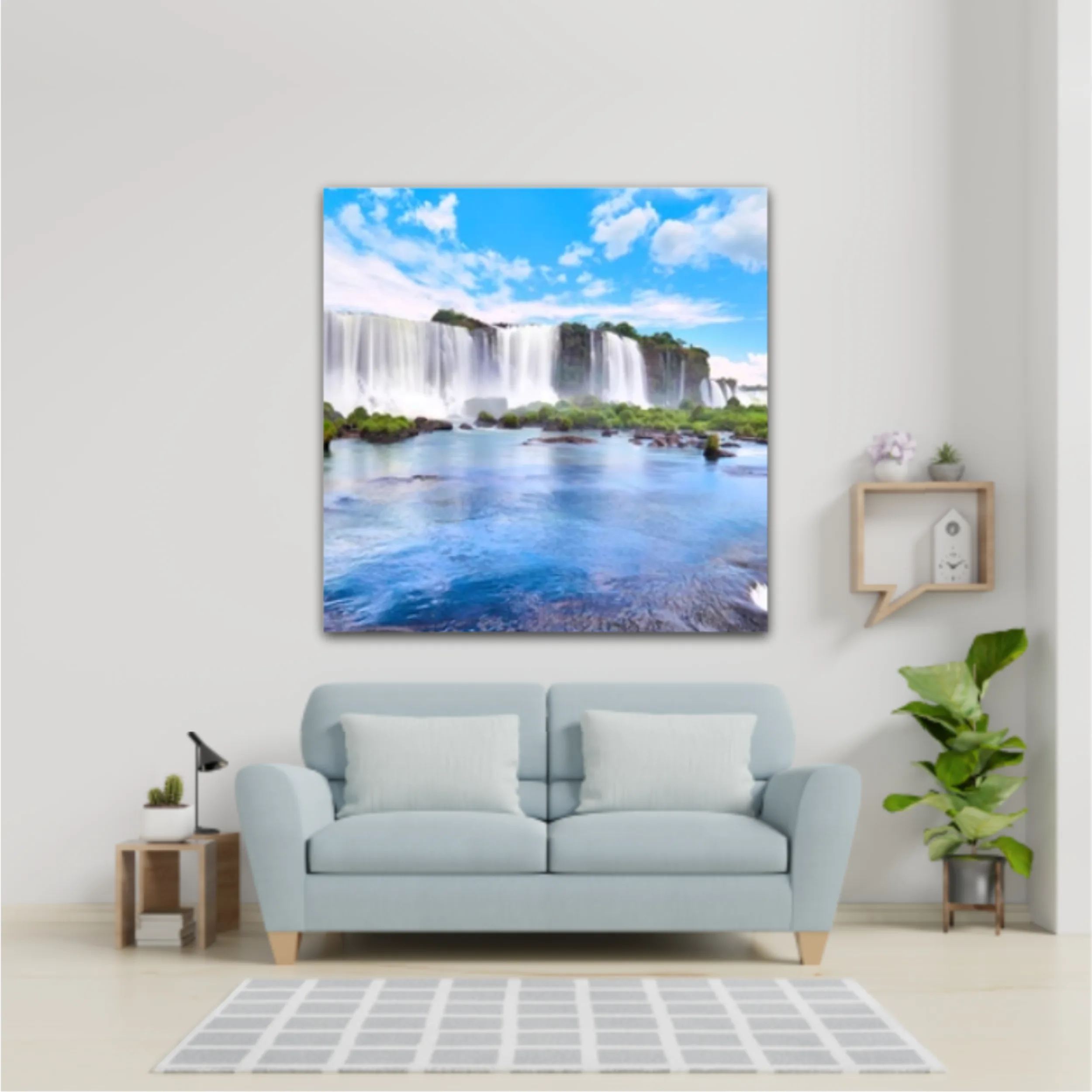 Panoramic view of many majestic powerful water cascades with mist and reflection of blue sky with clouds. Panoramic image of Iguazu valley