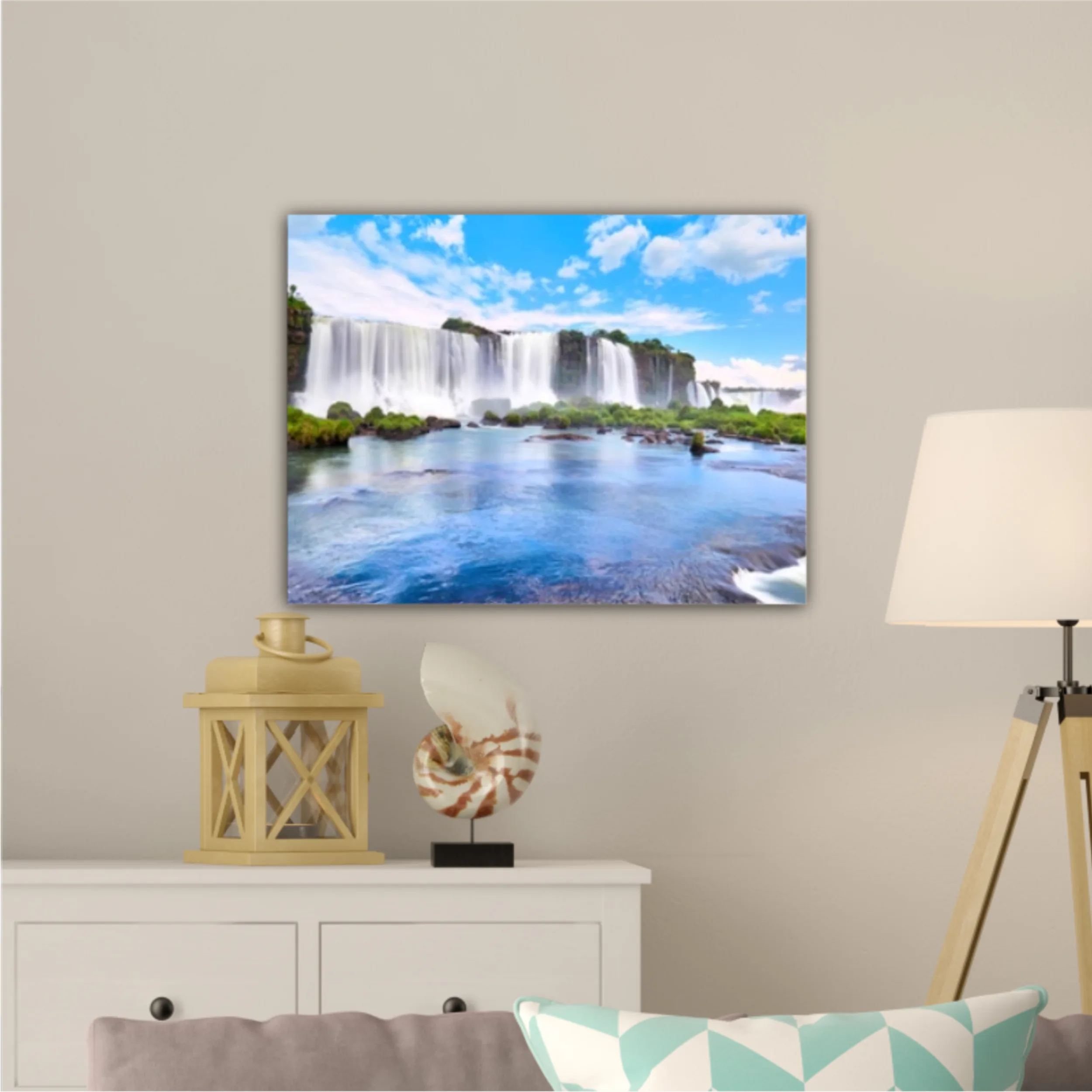 Panoramic view of many majestic powerful water cascades with mist and reflection of blue sky with clouds. Panoramic image of Iguazu valley