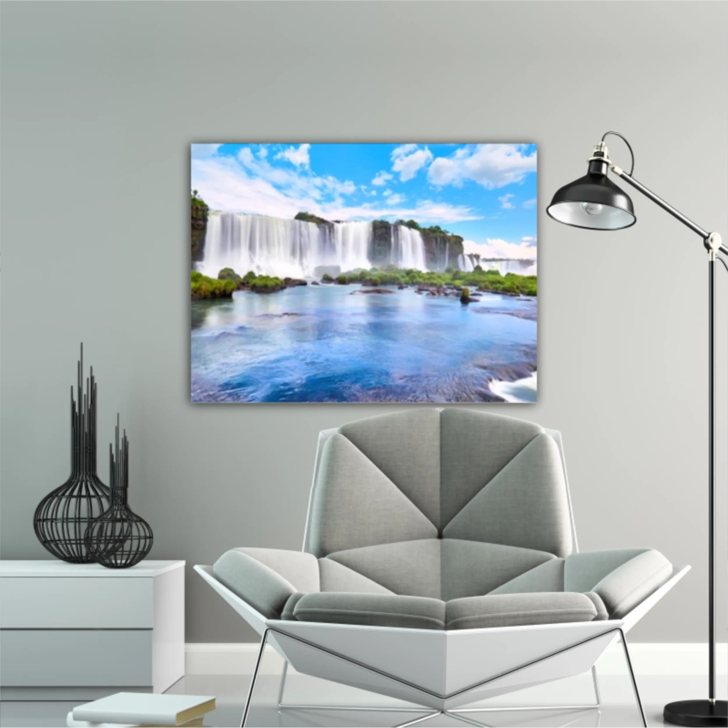 Panoramic view of many majestic powerful water cascades with mist and reflection of blue sky with clouds. Panoramic image of Iguazu valley