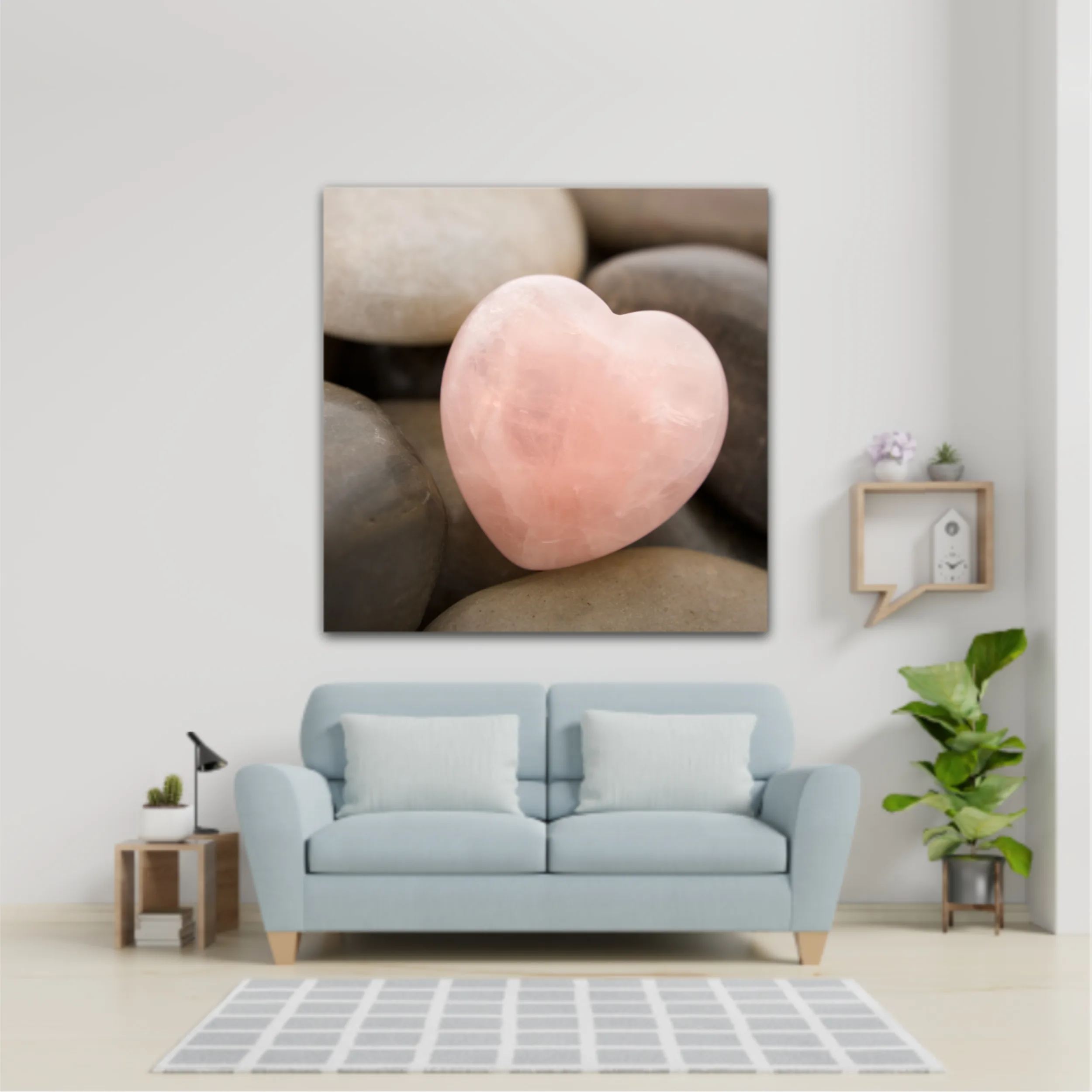 Rose quartz heart on pebbles