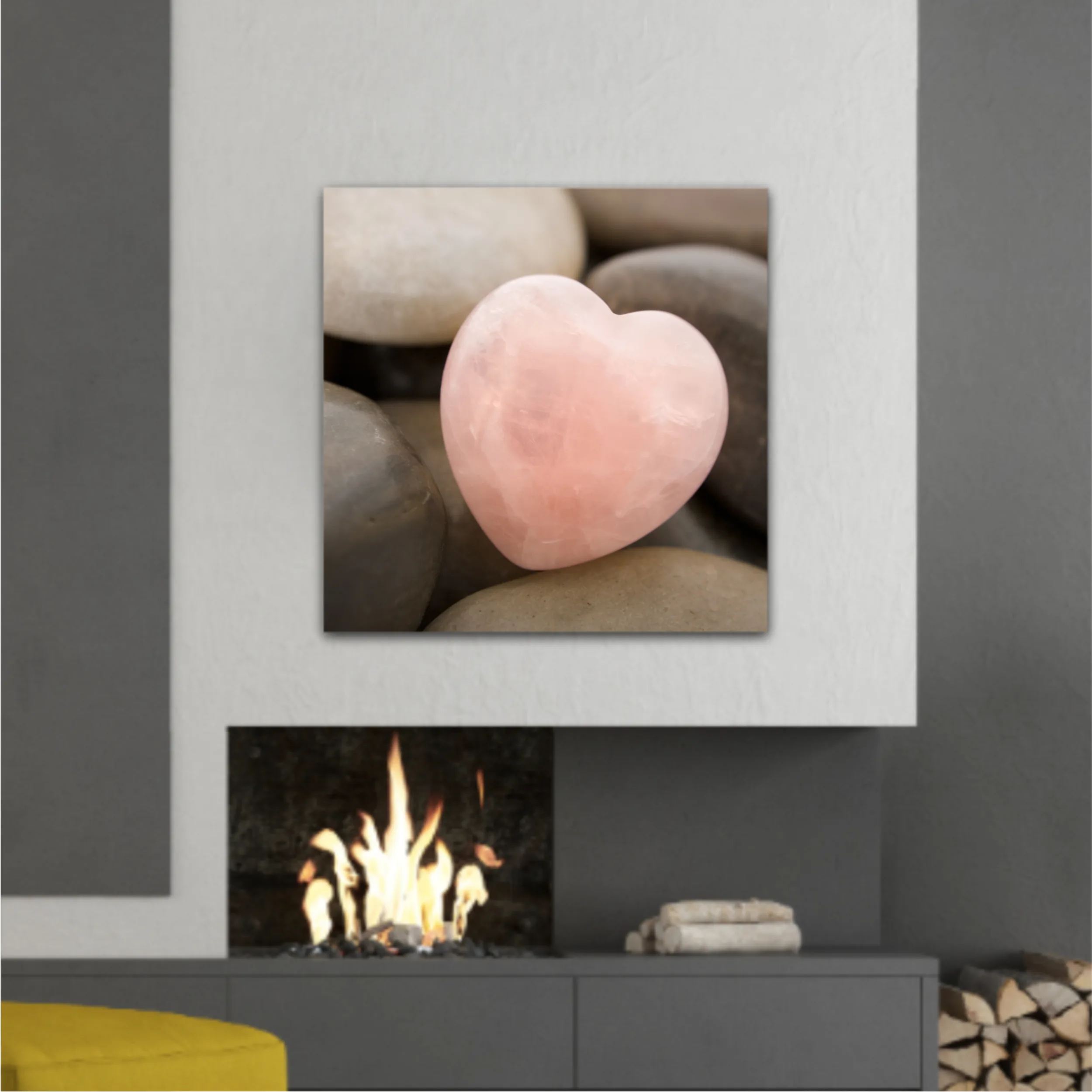 Rose quartz heart on pebbles