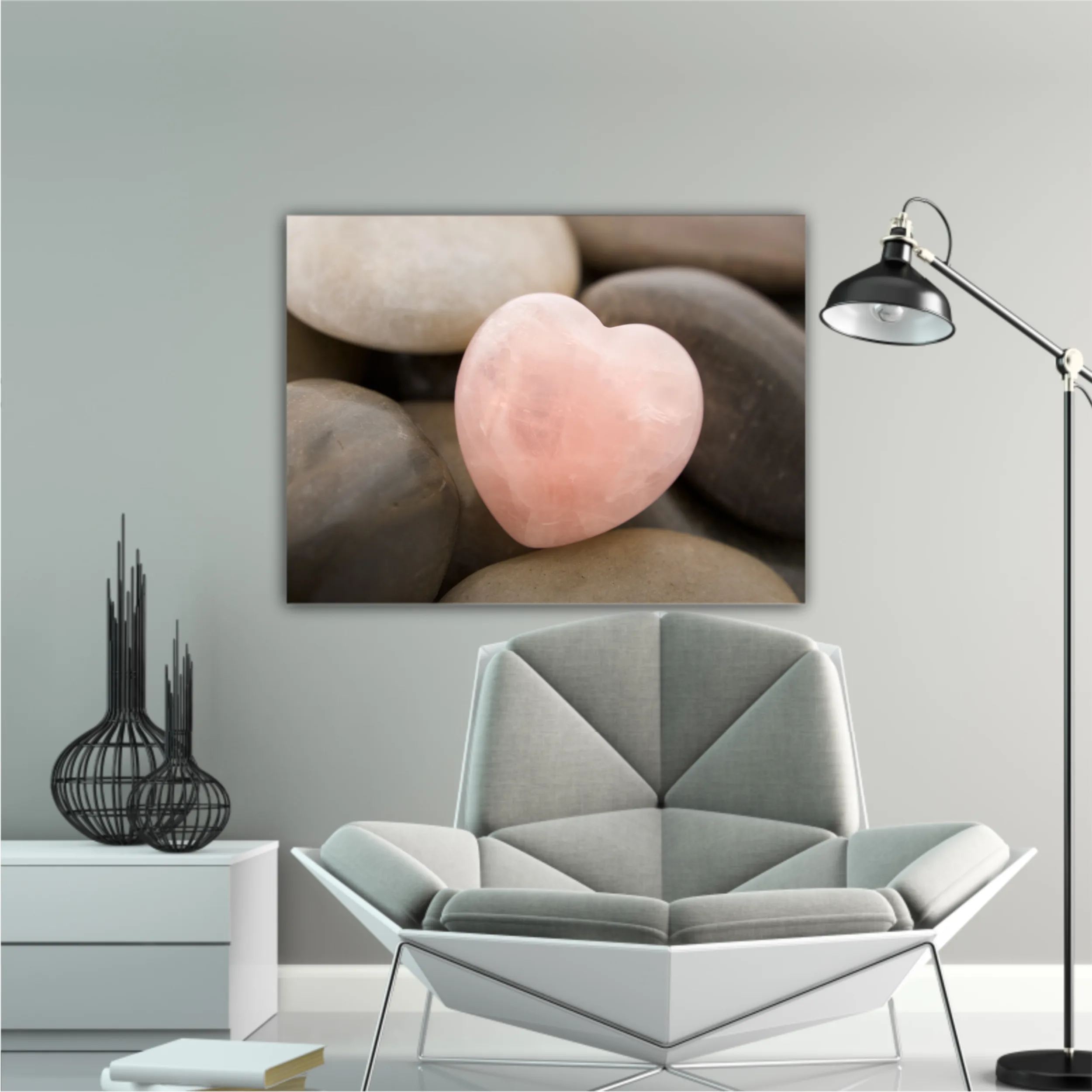 Rose quartz heart on pebbles