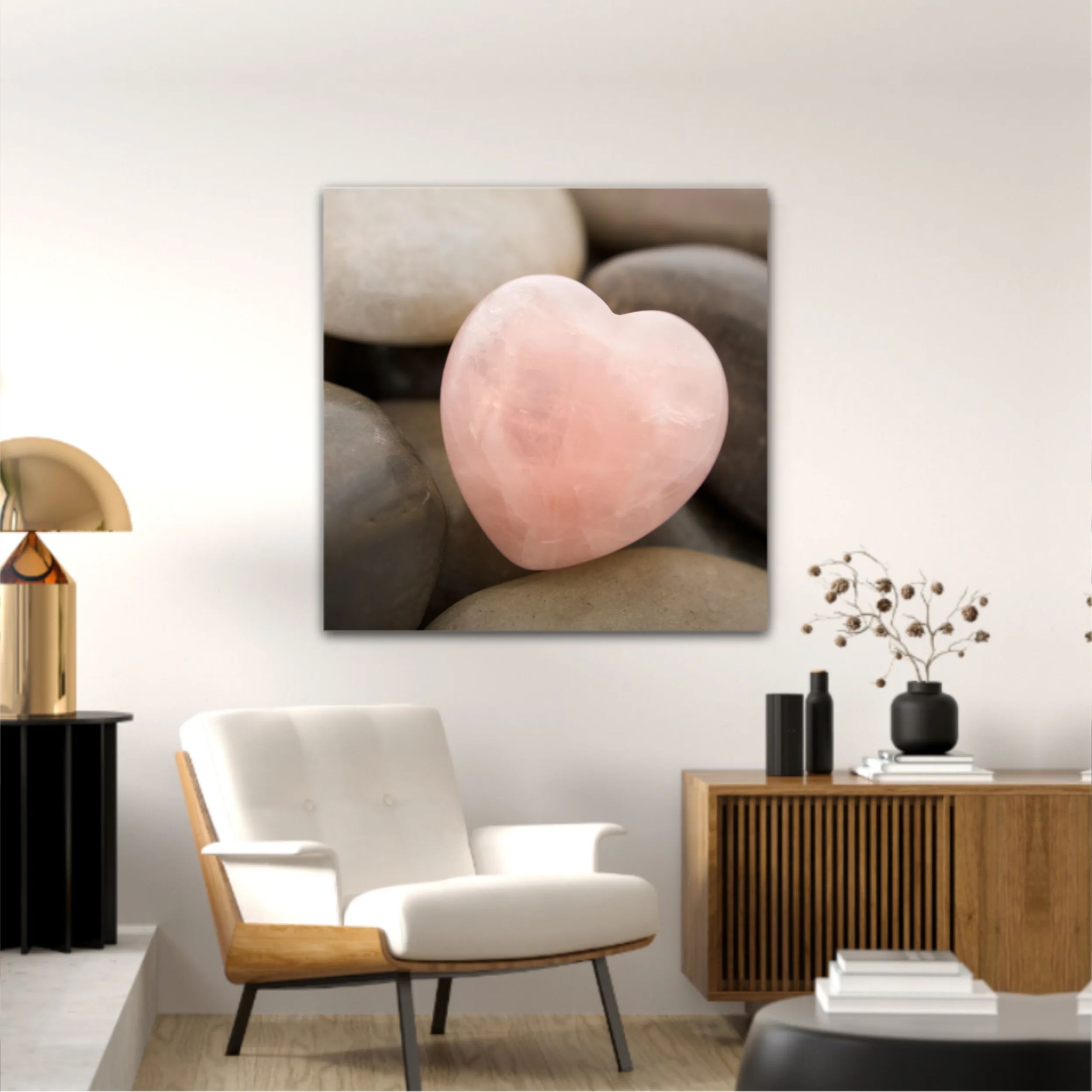 Rose quartz heart on pebbles